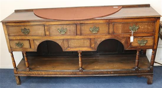 An early 18th century Welsh oak dresser base W.177cm